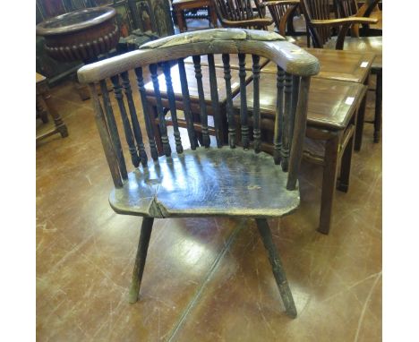 A 19th Century primitive stick back Chair with spindle frieze, solid seat on stick legs