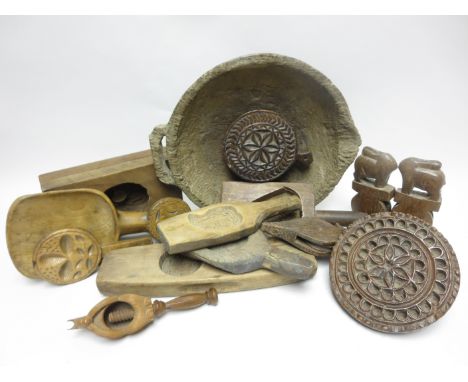 A primitive treen Skimmer, 13in, a treen Nutcracker in the form of a squirrel, two Pulleys with animal surmount, another, tre