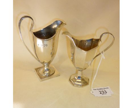 Two Adams style Sterling silver milk jugs, hallmarked for London 1893 Haseler Brothers, and the other Birmingham 1909 William