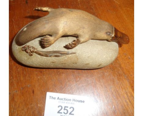 Gilt Bronze figurine of a platypus attached to a pebble with makers stamp AK for Tony Kean of Australia