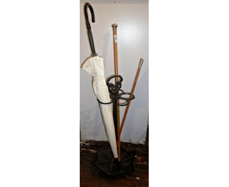 Silver topped walking cane, riding crop and umbrella in repro metal stick stand