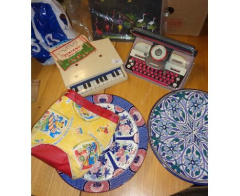 Toy tinplate typewriter, Sooty duffle bag, toy piano and two large plates