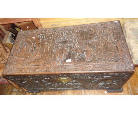 Oriental heavily carved camphor wood trunk