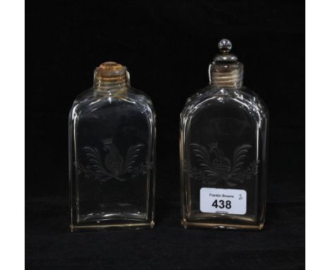A pair of late 18th century armorial engraved glass flask, one with a silver plated and cork stopper. 15.5cm  (2) 
