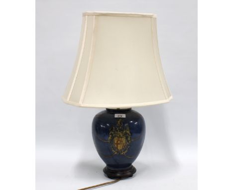 Armorial table lamp base with cream shade 