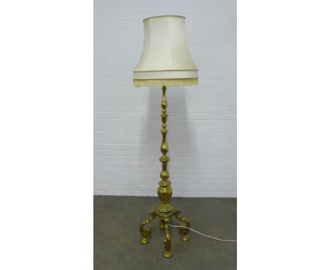 A Heavy brass knop stem standard lamp, standing on four scrolling feet, complete with shade  174cm. 