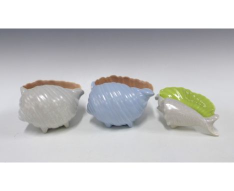 Three Poole pottery twintone conch seashells, tallest 12cm (3) 