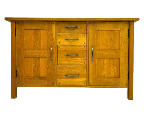 Laura Ashley - 'Milton' light oak sideboard, fitted with four central drawers flanked by two panelled cupboards, on square su