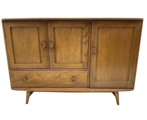 Ercol - elm and beech sideboard, fitted with cupboards and single drawer, enclosed by panelled doors, on splayed tapering fee