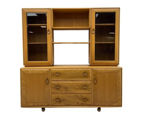 Ercol - elm wall unit, two raised display cabinets flanking shelves, fitted with three central drawers and two cupboardsDimen