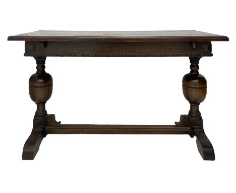 Early 20th century oak extending table, moulded rectangular top, pull-out action with fold-out leaf, on turned cup and cover 