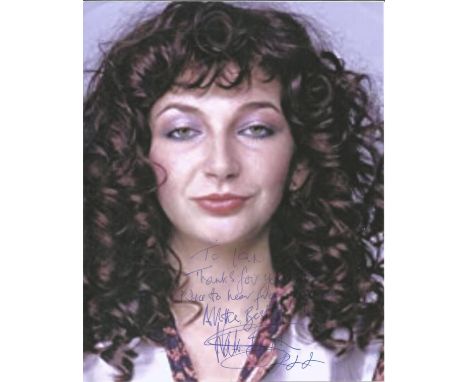 Kate Bush signed 12 x 8 grainy colour portrait photo dedicated to Ian. Good Condition. We combine postage on multiple winning