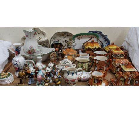 A collection of Goebel figures of cats playing musical instruments, Bees, Hummel figures, Guinness figures, cottage ware part