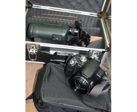 A Bushnell monocular telescope together with a Panasonic DMC-FZ18 digital camera