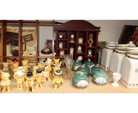 A large lot including a collection of pottery teddy bears, miniature clock collection, storage jars, animal figures, plates, 