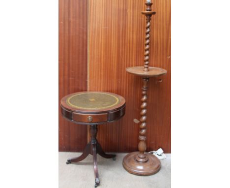 A standard lamp with a barley twist column together with a reproduction drum table