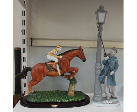 A Lladro figure of a lamp lighter together with a resin figure of a jump jockey