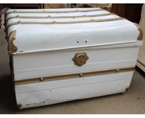 A cream and gold painted trunk