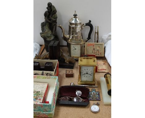 A Mappin and Webb carriage clock together with another carriage clock, bronzed family group statue, dog book ends, Schuco clo