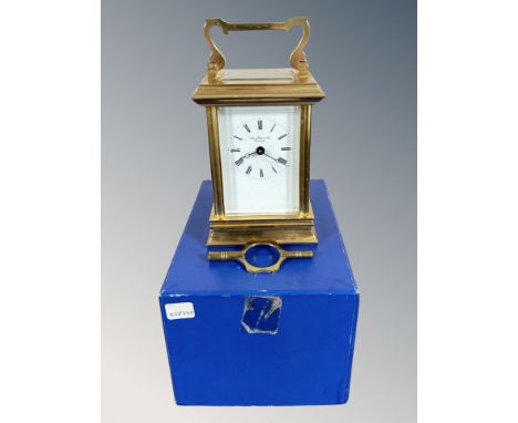 A heavy quality brass carriage clock with key by James Ritchie & Son, boxed.