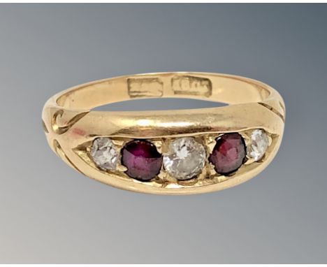 An antique 18ct gold ruby and diamond ring, size M CONDITION REPORT: 4.5g The central diamond approximately 3 mm in diameter.