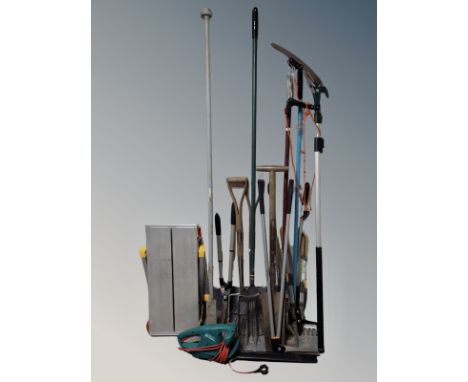 A folding aluminium stand, electric hedge trimmer and bundle of garden tools 