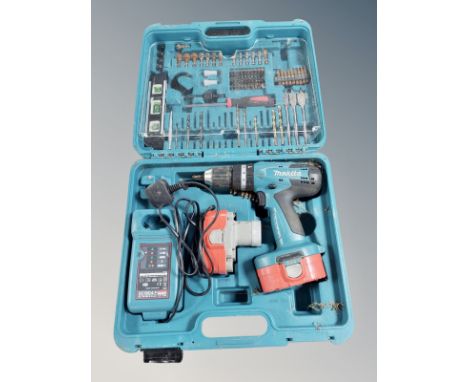 A Makita drill in box, with charger, together with an antique tin trunk