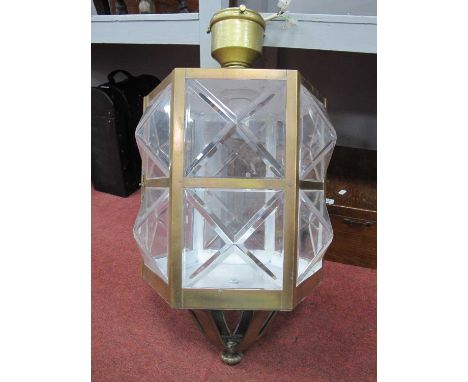 A hexagonal brass bound lantern with protruding pryamid panels to sides, converted into an electrical lamp.