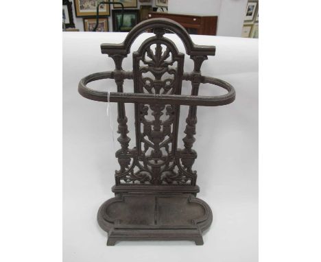 Cast Iron Stick Stand, with pierced back oval upper band on shaped base, holding detachable drip tray, 49.5cm high.