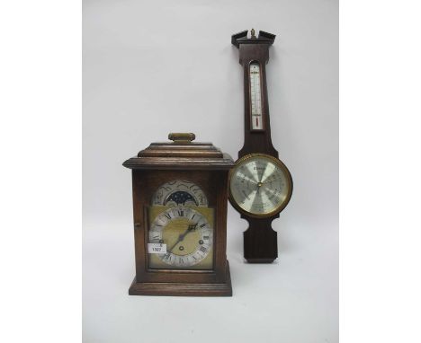 Oak Cased Bracket Clock, with brass carrying handle, dial with a moon, silver chapter ring, Roman numerals; together with a b