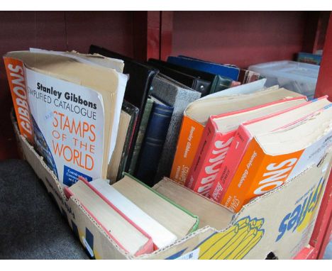 Stamps; A large box containing twelve empty stamp albums and stockbooks, plus a selection of philatelic catalogues.