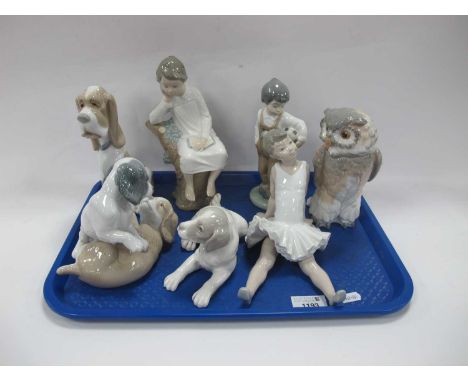 Nao Figurines - three dog groups, footballer, ballerina, owl, Lladro seated girl 20.5cm high (7):- One Tray.No chips, cracks 