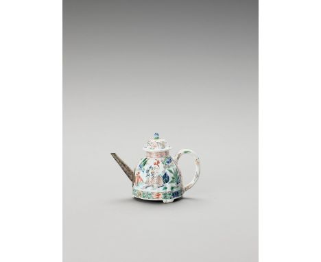   A FAMILLE VERTE TEAPOT AND COVER  China, Kangxi period (1662-1722). Of fluted form with three short feet and slender handle