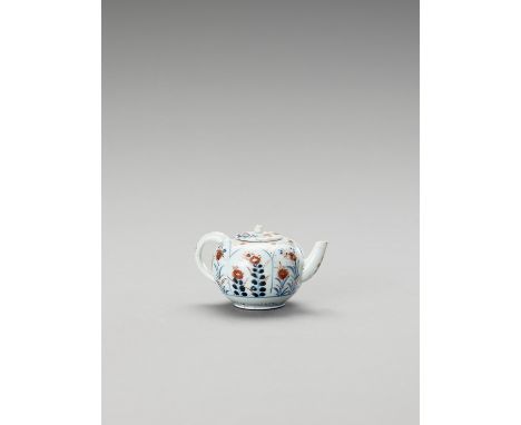   AN IMARI PORCELAIN TEAPOT WITH COVER  Japan, Edo period (1615-1868)    The oval-shaped pot with rounded handle is finely pa