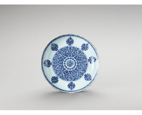   A BLUE AND WHITE PORCELAIN CHARGER  China, Kangxi period (1662-1722). Painted in underglaze blue with a central medallion w