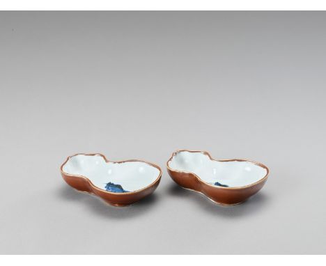   A PAIR OF GOURD-SHAPED PORCELAIN SAUCERS  China, Kangxi period (1662-1722). Both of gourd shape, painted in underglaze blue