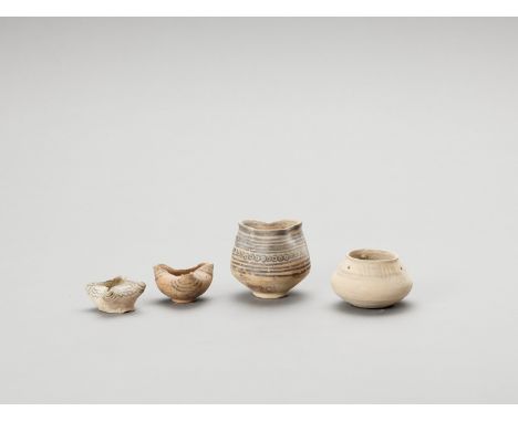   FOUR ANTIQUE CERAMIC OIL LAMPS FROM INDUS VALLEY  Indus Valley, Pakistan, Nidowari and Mehrgarh culture (c. 2500 BC). This 