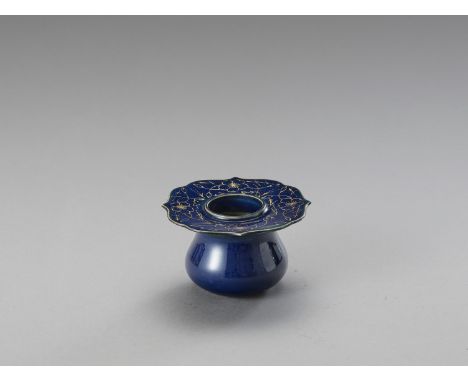  A POWDER BLUE INKWELL  China, 19th century. Of spherical body with broad flat rim shaped as four petals, glazed in a powder