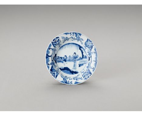  A LOBED BLUE AND WHITE PORCELAIN BOWL  China, Kangxi period (1662-1722). The lobed bowl decorated in underglaze blue on the