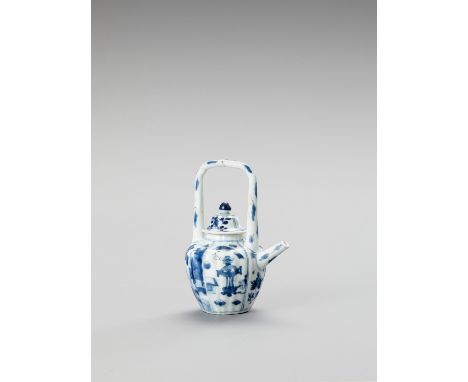   A BLUE AND WHITE PORCELAIN TEAPOT  China, Kangxi period (1662-1722). The baluster shaped lobed teapot with high handle and 