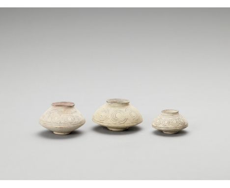   THREE NAL WARE CERAMIC POTS  Indus Valley, Pakistan, Nal culture (around 3100-2700 BCE). Three biconical ceramic pots in gr