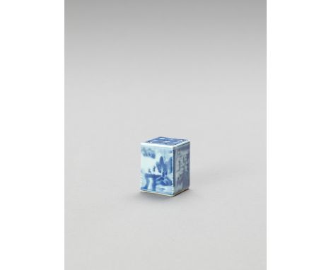   A BLUE AND WHITE PORCELAIN INKWELL  China, 19th century. Of rectangular shape, the top with four narrow apertures to each c