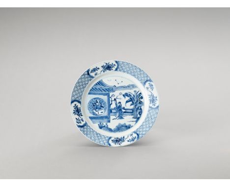   A BLUE AND WHITE PORCELAIN DISH  China, Kangxi period (1662-1722). The dish is decorated on the show side with two ladies l