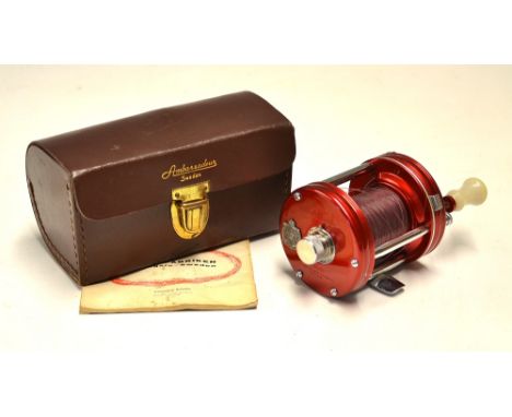Fine Abu Ambassadeur 6000 level wind multiplying reel - with red end plates, complete with the original leather case, spares,
