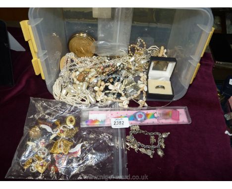 A quantity of costume jewellery to include; shell necklace, compact, clip on earrings, etc.