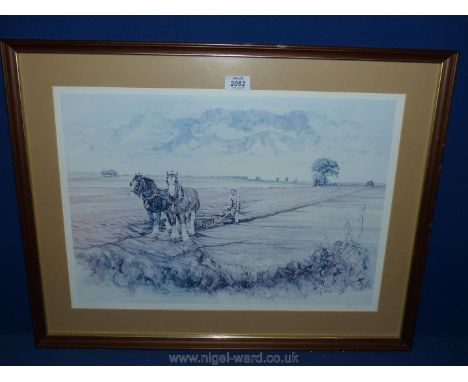A framed and mounted limited edition print ,no. 12/500, signed J.R Hunt, of two horses ploughing.