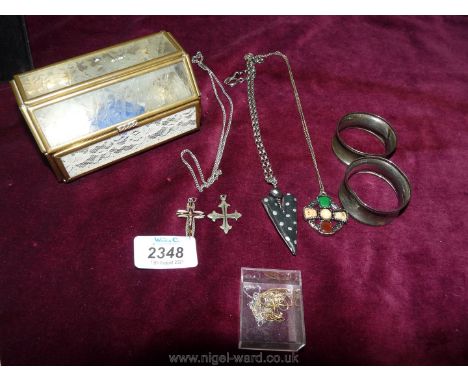 A small quantity of jewellery including pendants, fine silver and gold chains, Celtic pendant, modern black and white pendant