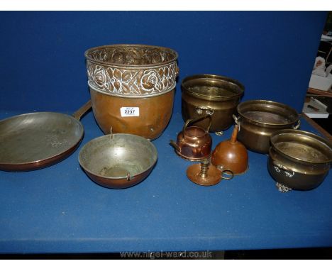 A quantity of copper including a funnel. frying pan, jardiniere, chamber stick, three graduated plant pots, etc.