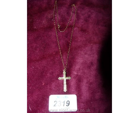 A 9ct gold cross and chain.