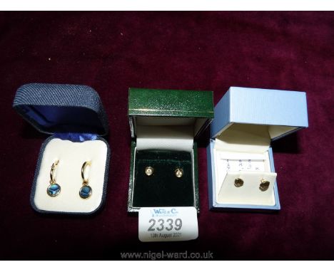 Three pairs of  ear-rings including 9 ct gold with white stone, yellow metal heart shaped and Paua shell ear-rings.